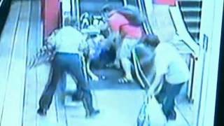 Woman rolls down escalator in motorised wheelchair [upl. by Siuol]