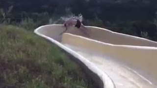 Man flies off waterslide onto rocky cliff [upl. by Nivle]