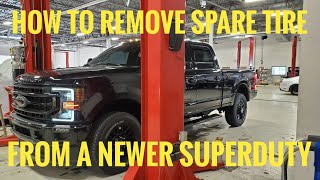 FordHow to Remove SPARE TIRE NEWER Ford Superduty Truck [upl. by Rosalia]