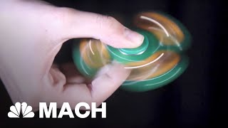 How Fidget Spinners Seem To Spin Forever  Mach  NBC News [upl. by Llertnom]